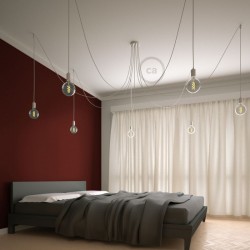 Exemple d'une suspension multiple câble blanc dans une chambre
