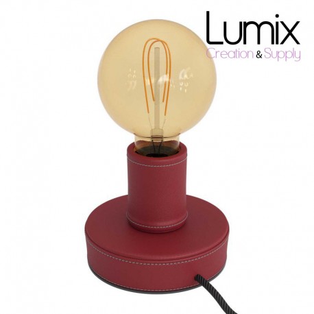 Wooden table lamp covered with burgundy leather, with textile cable, switch and two-pole plug