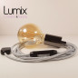 Lampe à suspendre type baladeuse porte-douille métal lisse Perle noire de Tahiti - Câble textile Argent effet soie Lampe à suspendre type baladeuse porte-douille métal lisse Perle noire de Tahiti - Câble textile Argent effet soie