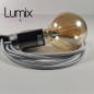 Lampe à suspendre type baladeuse porte-douille métal lisse Perle noire de Tahiti - Câble textile Argent effet soie Lampe à suspendre type baladeuse porte-douille métal lisse Perle noire de Tahiti - Câble textile Argent effet soie