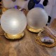 Pair of lamps to place from the 1960s-1970s brass base and glass globe